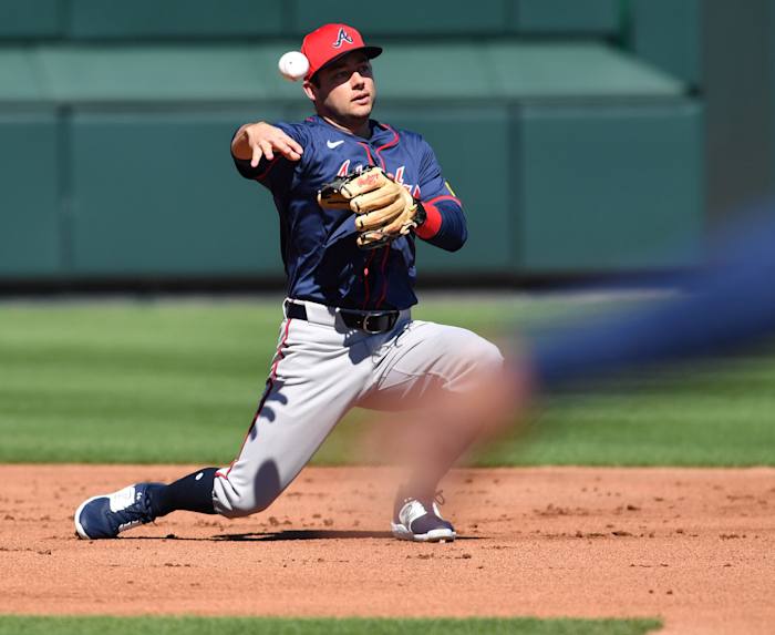 Braves infielder David Fletcher (#64) throws to second base during a fielding drill Tuesday, Feb. 20, 2024 at CoolToday Park in North Port, Florida.
